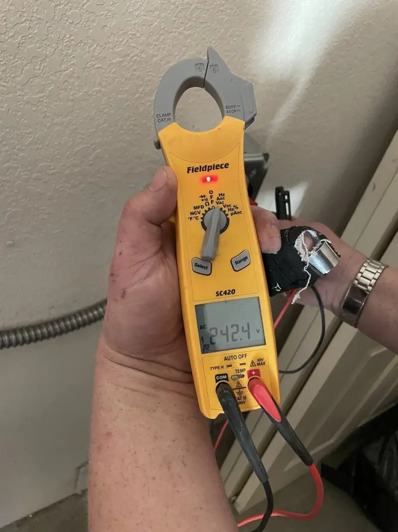 Voltage testing with clamp meter during Ceiling Fan Installation in Oscoda